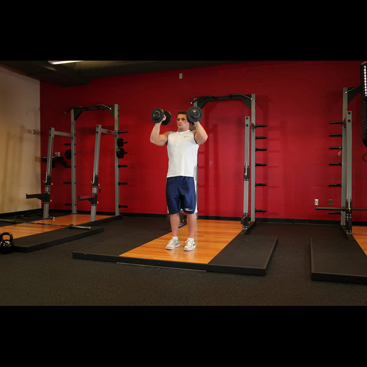 техника выполнения упражнения: Жим гантелей стоя (Standing Palms-In Dumbbell Press) на фото